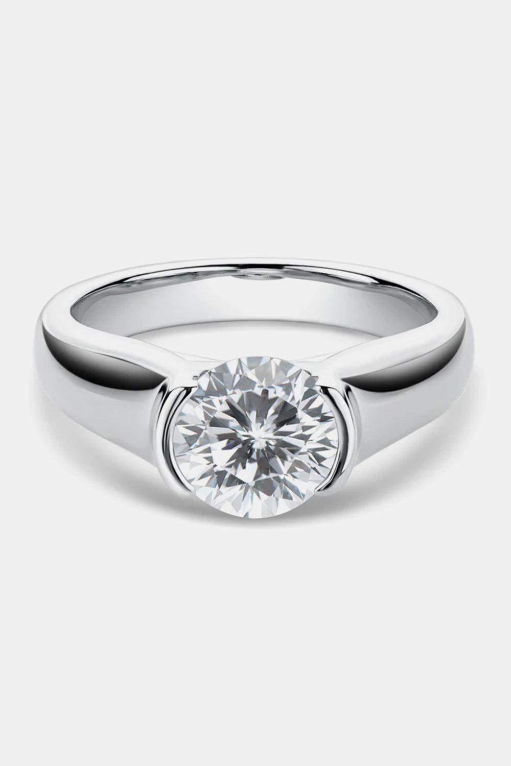 a white gold engagement ring with a round brilliant diamond