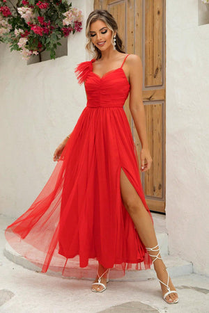 a woman in a red dress posing for a picture