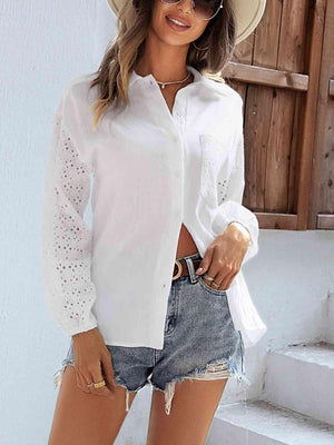 a woman wearing a white shirt and denim shorts