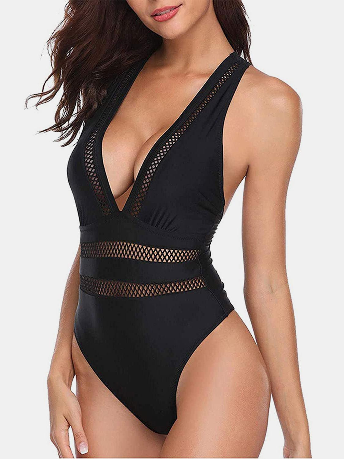 a woman in a black bodysuit with cut outs