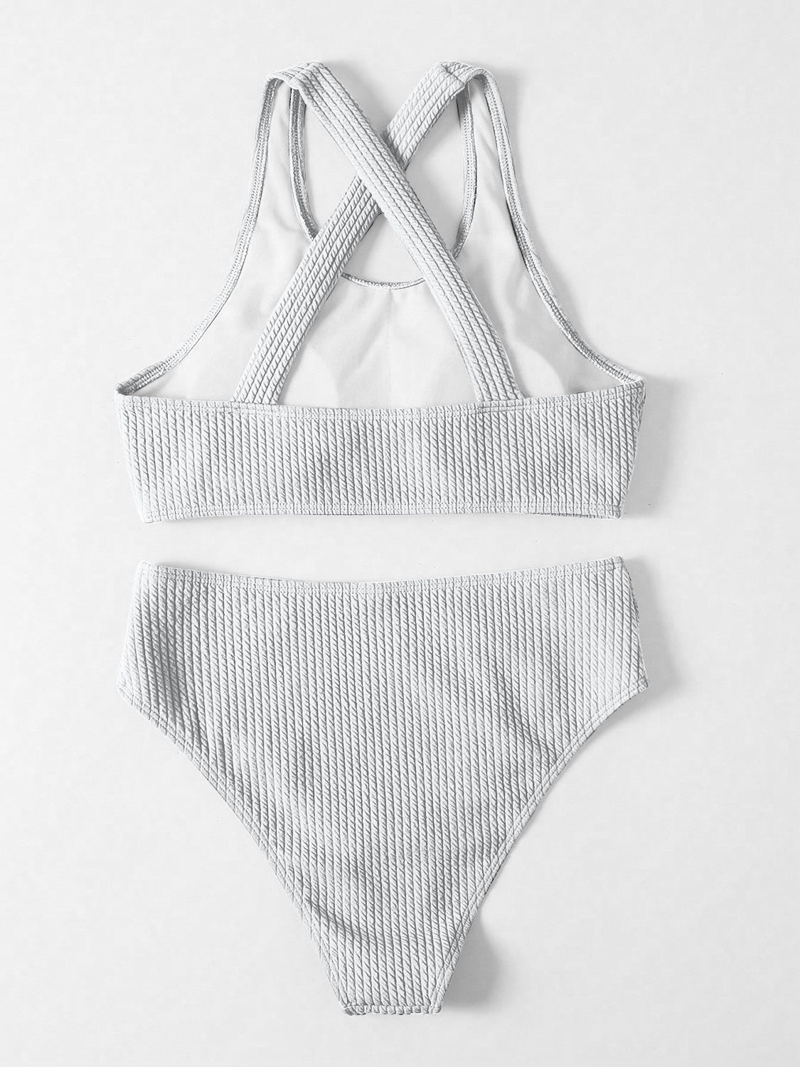 a white bikini top and bottom with straps