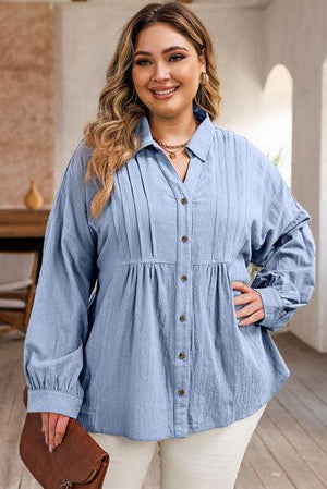 a woman wearing a blue shirt and white pants