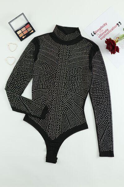 a black bodysuit with white dots on it