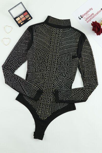 a woman's bodysuit with a black and white pattern