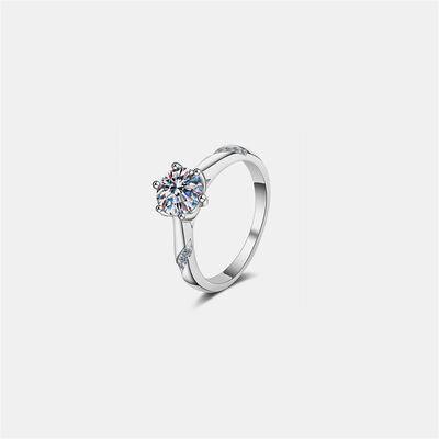 a white gold ring with a diamond