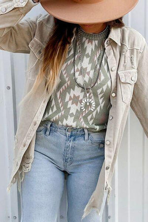 a woman wearing a cowboy hat and jeans