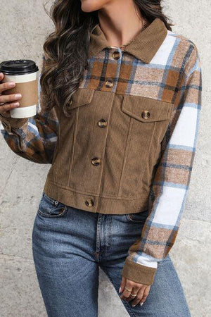 a woman is holding a cup of coffee