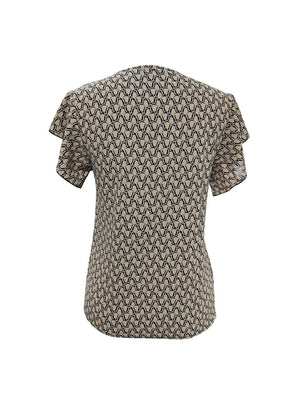 a women's shirt with a pattern on the back