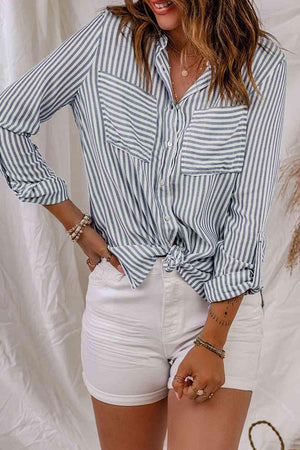 a woman wearing white shorts and a striped shirt