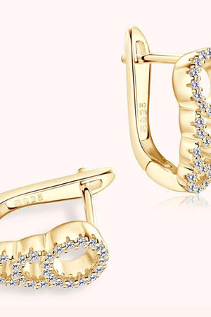 a pair of yellow gold earrings with diamonds