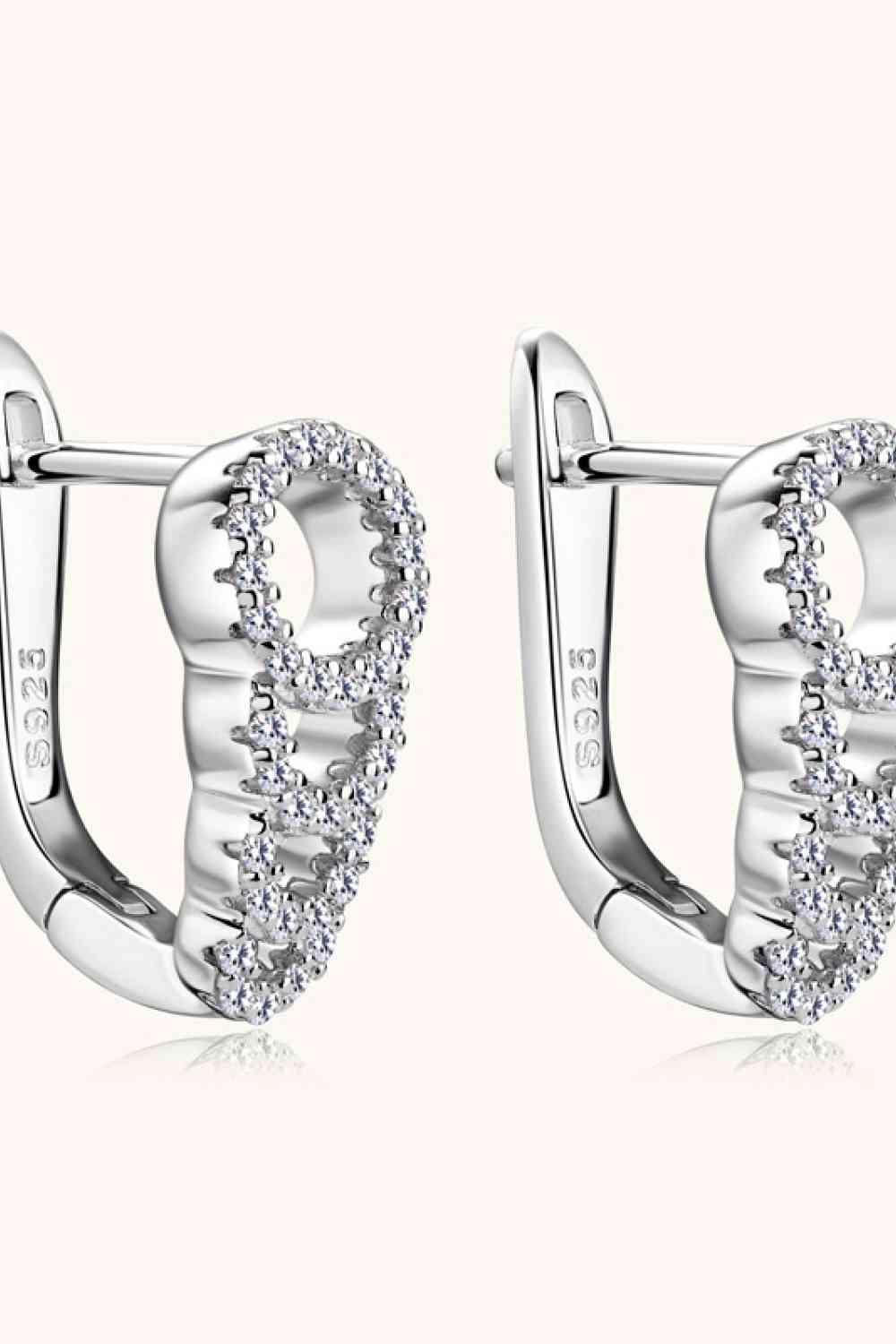 a pair of white gold earrings with diamonds