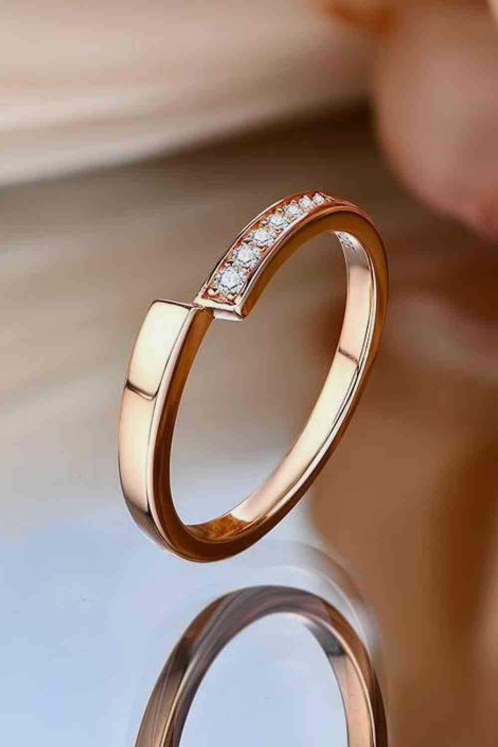 a close up of a diamond ring on a table