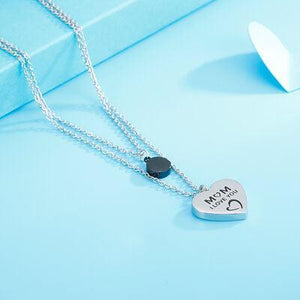 a heart shaped necklace with a message on it