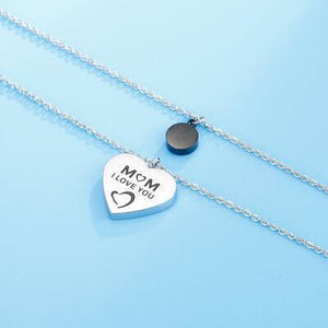 a mother's love heart necklace on a blue background