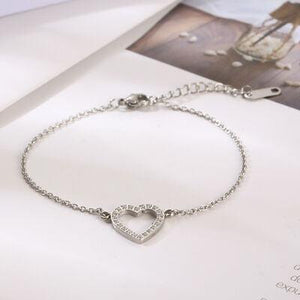 a silver bracelet with a heart on it