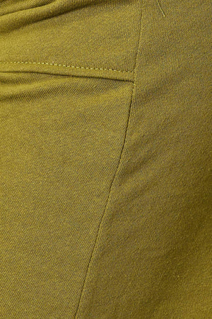 a close up of a person wearing a pair of green pants