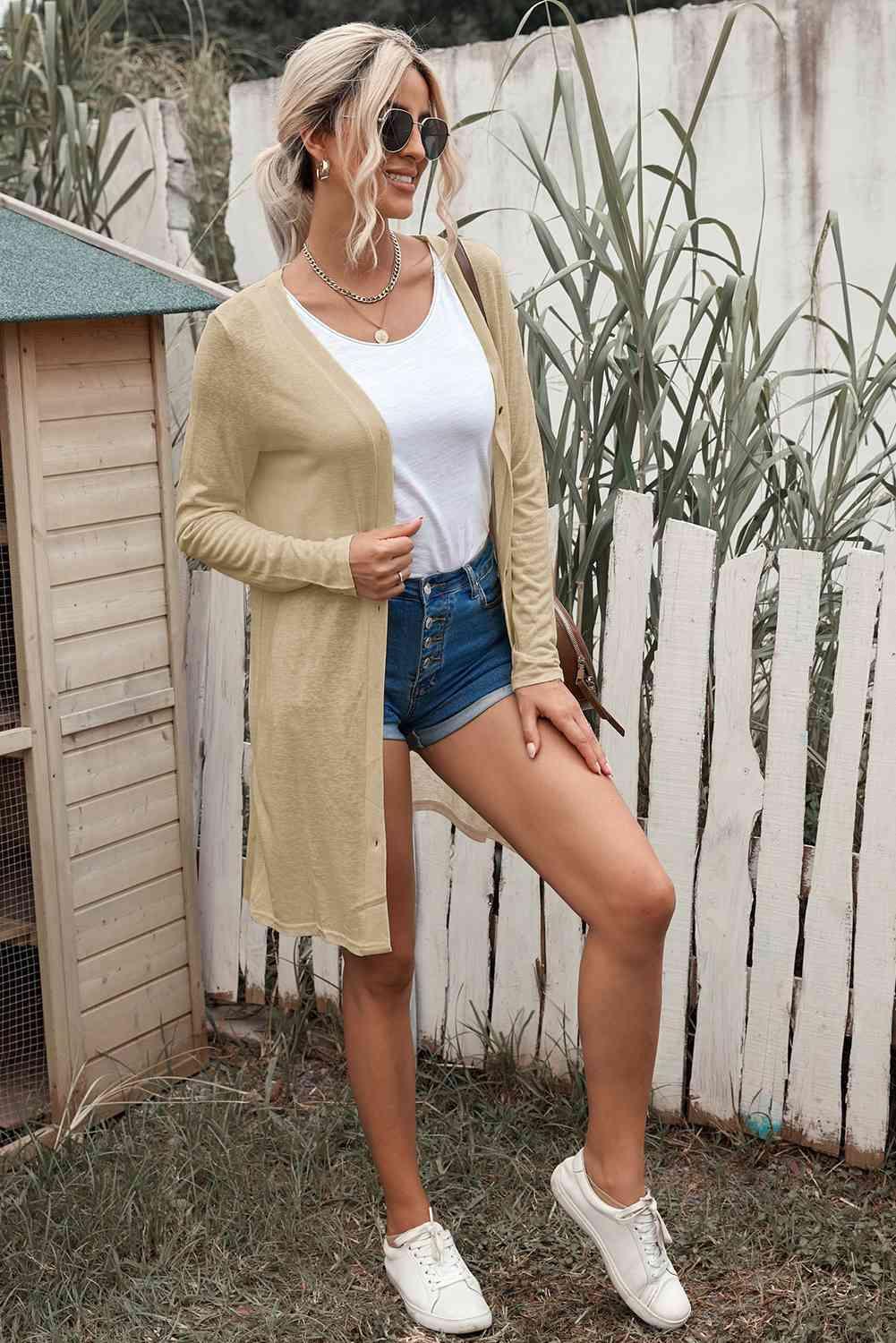 a woman standing in front of a fence