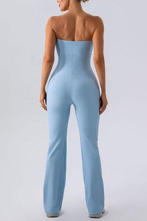 a woman in a light blue jumpsuit