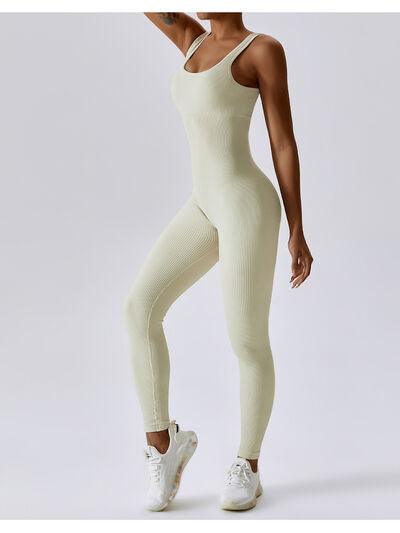 a woman wearing a white bodysuit and white sneakers