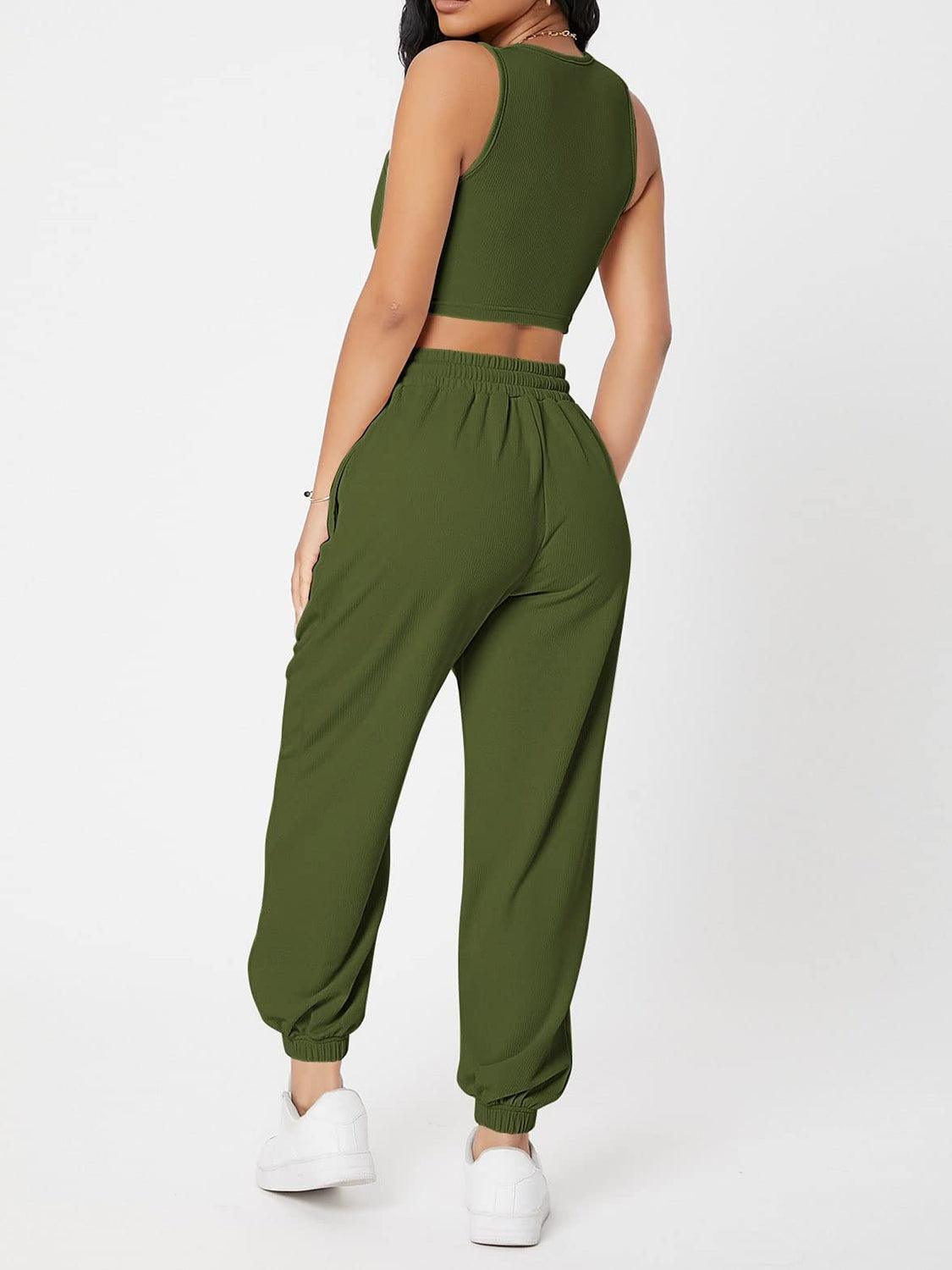 a woman wearing a green crop top and pants