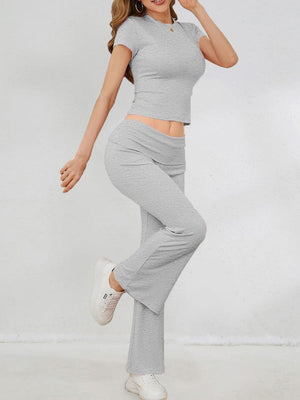 a woman in a gray top and grey pants