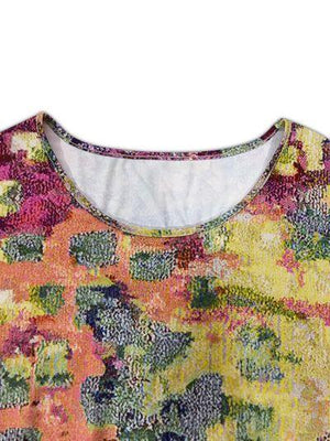 a close up of a shirt with flowers on it