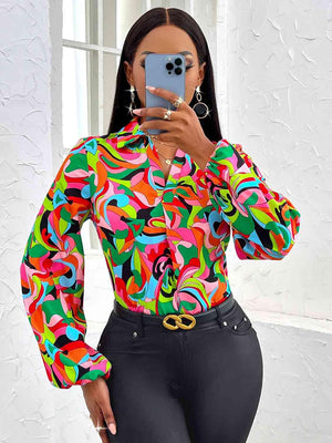 a woman taking a selfie in a colorful shirt