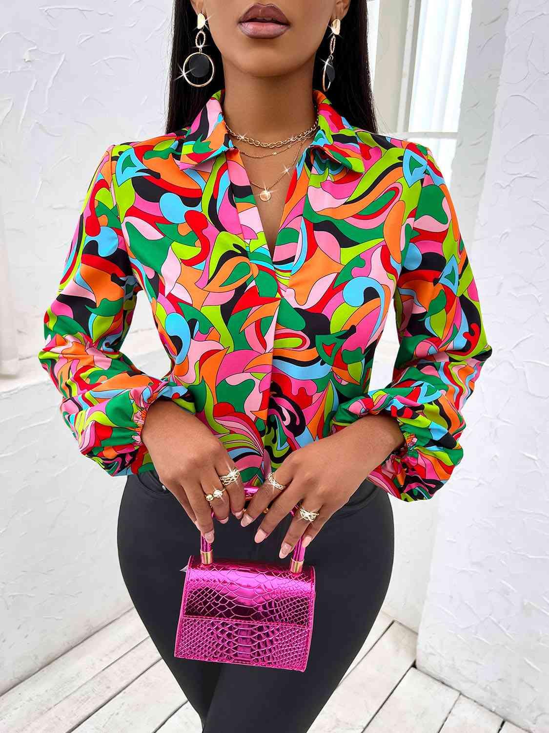 a woman in a colorful shirt holding a pink purse