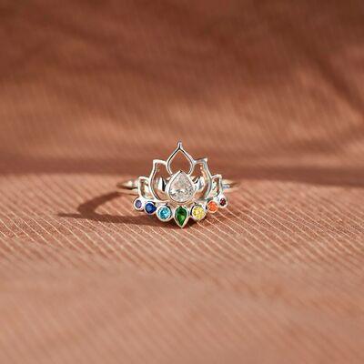 a ring with a crown made of multicolored stones