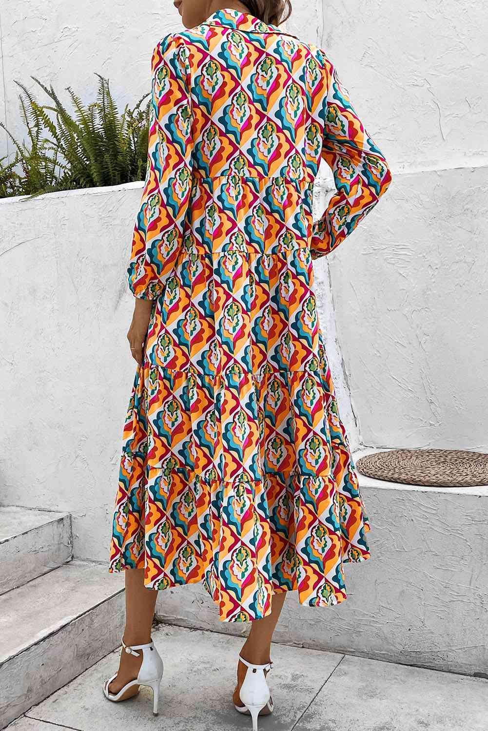 a woman standing on a sidewalk wearing a colorful dress