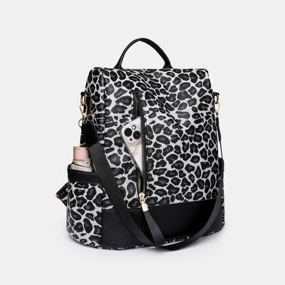 a black and white backpack with a skull on it