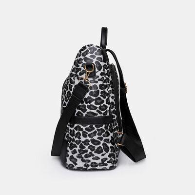 a leopard print backpack with a black strap