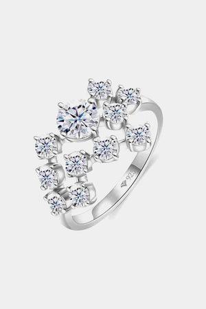 a white gold ring with four diamonds