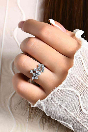 a woman's hand with a diamond ring on it