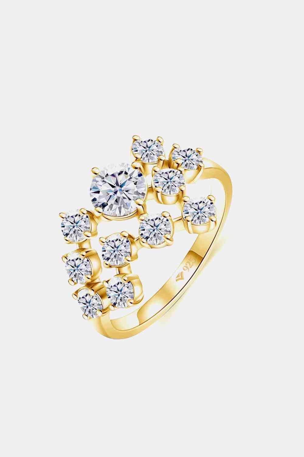 a yellow gold ring with diamonds on it