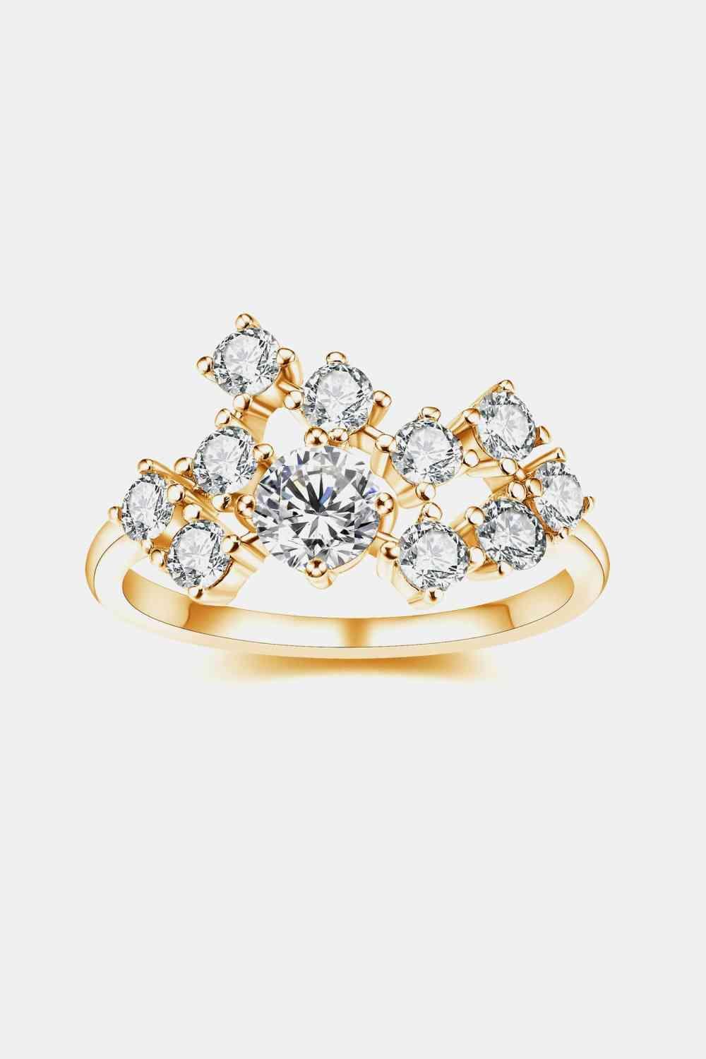 a yellow gold ring with a white diamond