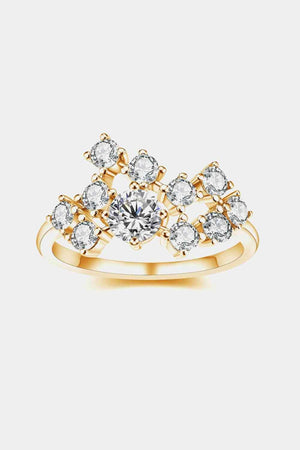 a yellow gold ring with a white diamond