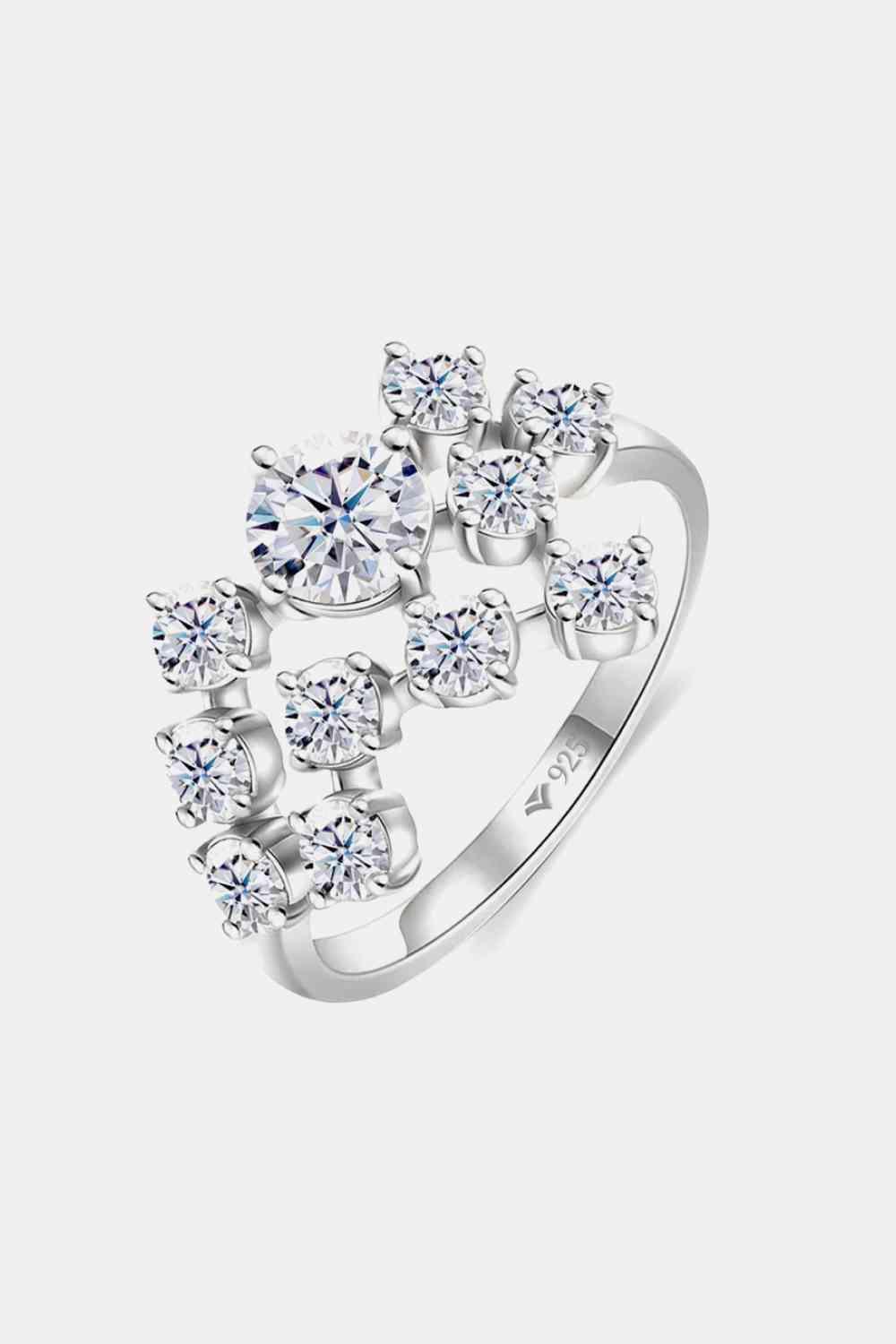 a white gold ring with four diamonds