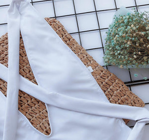 a close up of a white dress on a table