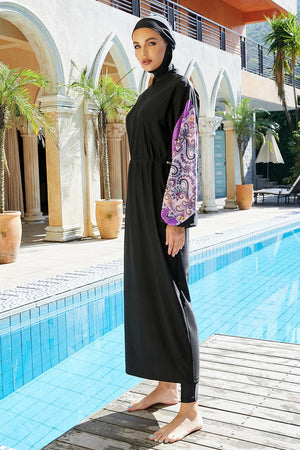 a woman standing next to a swimming pool