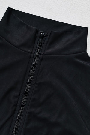 a close up of a black jacket with zippers