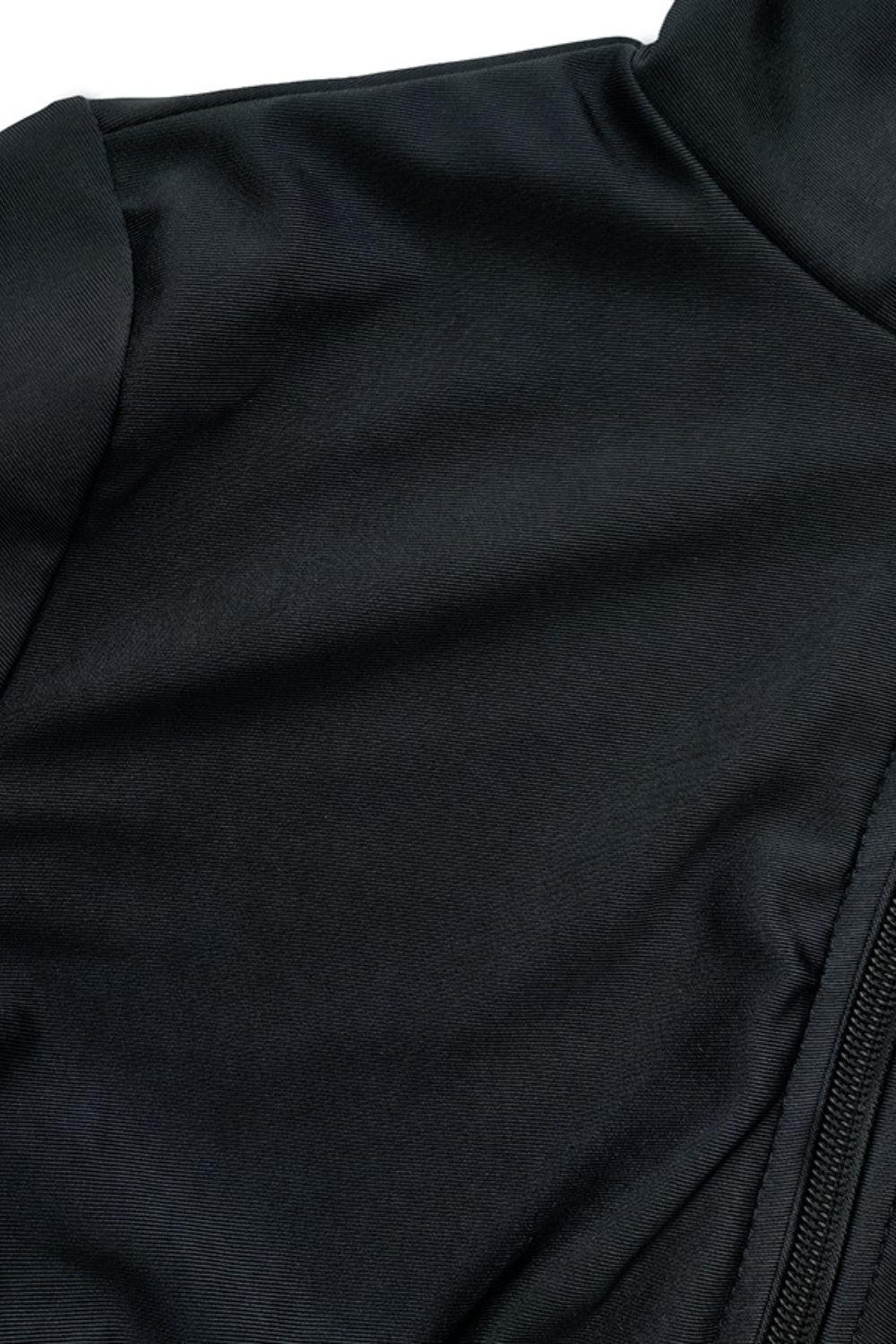 a close up of a black jacket on a white background