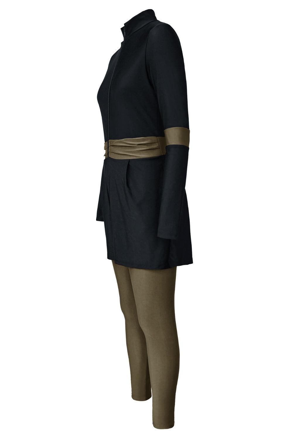 a mannequin wearing a black coat and brown pants