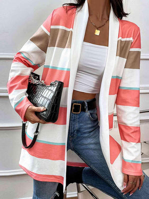 a woman sitting on a chair holding a purse