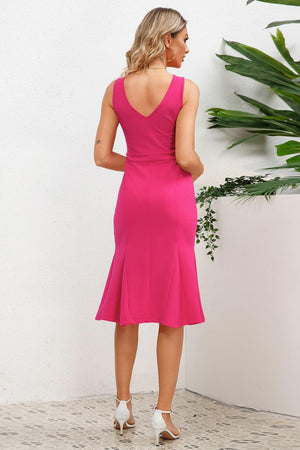 a woman in a bright pink dress