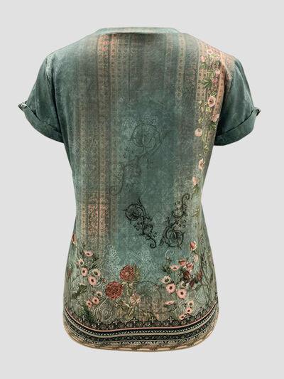 a woman's top with a floral design on the back