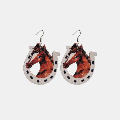 a pair of earrings with a horse on it