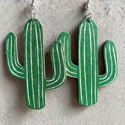 a pair of green cactus earrings hanging from a hook