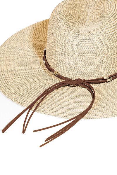 a straw hat with a brown string around the brim