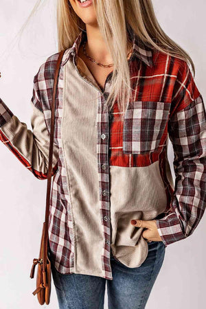 a woman wearing a plaid shirt holding a cell phone